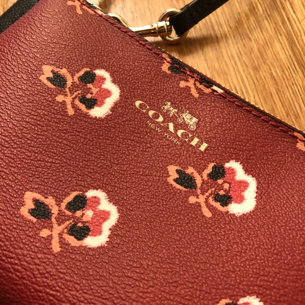 Coach Wristlet with floral print